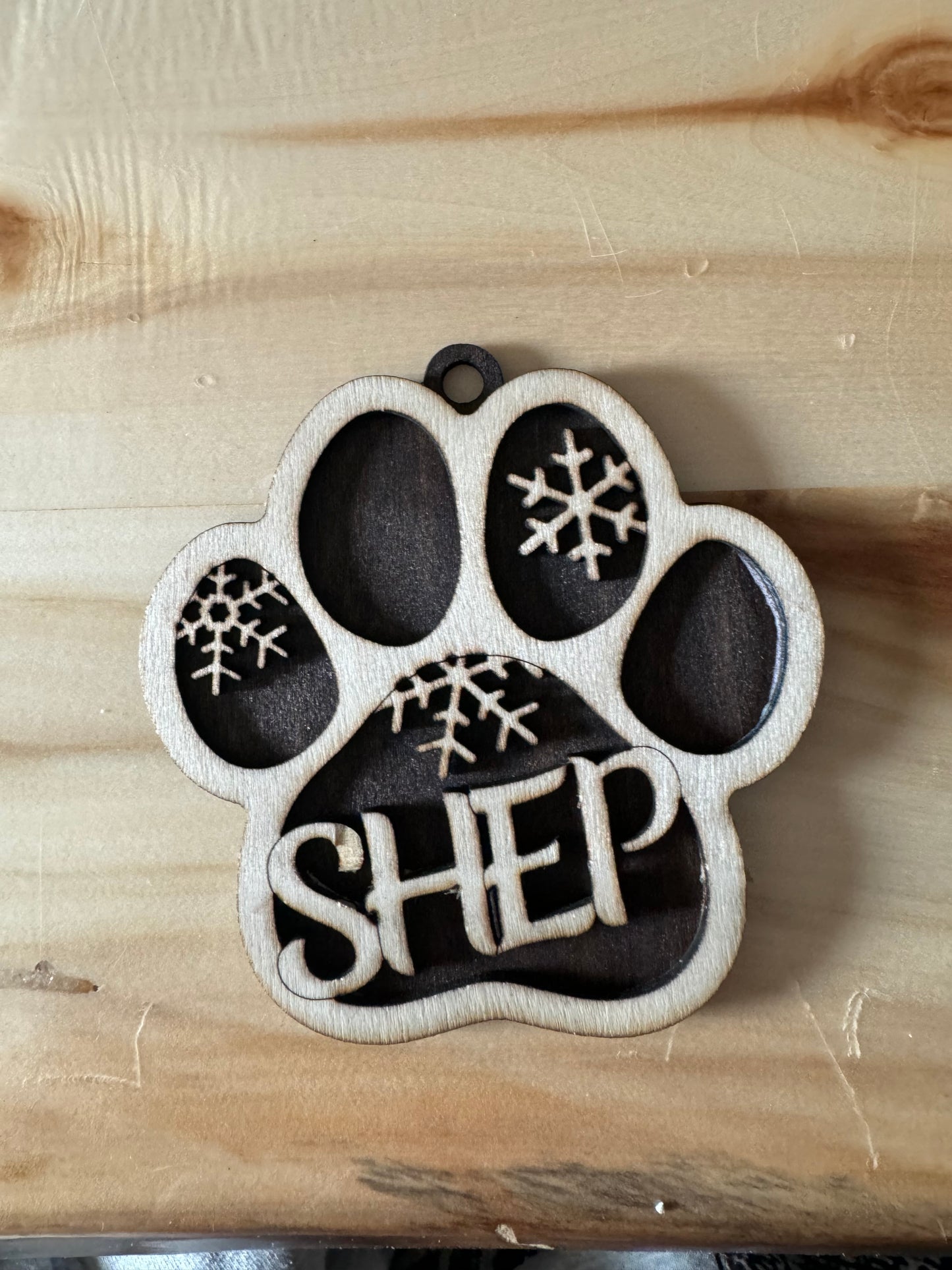 Dog paw print ornament buy before Nov 18th and $5 will go towards the Elk country Animal Shelter