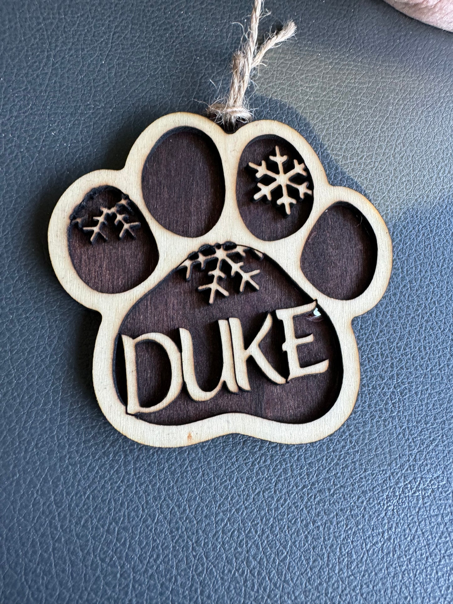 Dog paw print ornament buy before Nov 18th and $5 will go towards the Elk country Animal Shelter